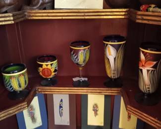 Upper top left leather boy's cowboy boots. Bttom shelf Costo Rico hand-painted feathers.