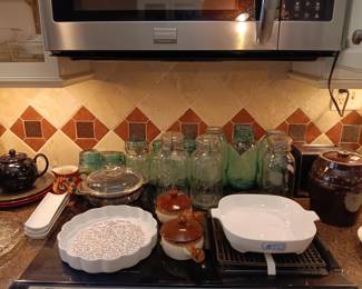 Blue and clear canning jars. Some with zinc lids.