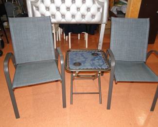 Nice pair of matching outdoor chairs, with small center table.  Or you can use them indoors as well