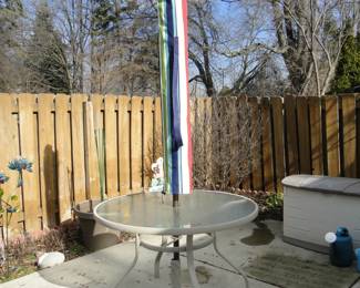 Small round patio table and umbrella