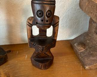 Hand carved brown wood figurine.