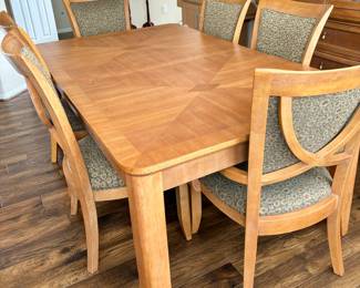 Beautiful Light Wood Dining Room Table with Leaf and 6 Upholstered Chairs. Table Measures 72" without the 22" leaf.