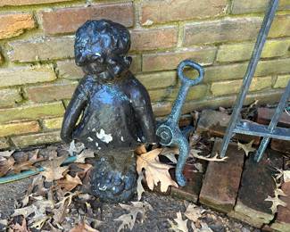 Lots of yard art and wrought iron patio furniture 
