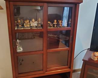 Glass Front Cabinet with Sliding Doors - Yes, there is a drawer that goes in the bottom. 