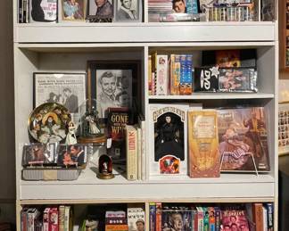 2 of 3 loaded Media Room cabinets with movies music books of numerous artists. VHS DVDs CDs Cassettes