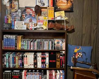 1 of 3 loaded Media Room cabinets with movies music books of numerous artists. VHS DVDs CDs Cassettes