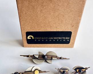 New Bronze Art Deco Style Bronze, Gold & Treated Silver 2 Pins & Earrings From Chicago Architecture Foundation
Lot #: 11