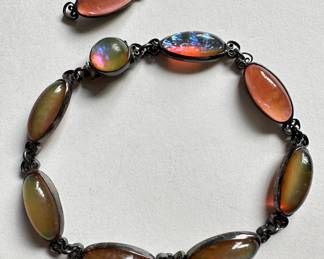 Vintage Dragon's Breath & Sterling Silver Bracelet In Original Frederick Loeser & Co Box, With Extra Link
Lot #: 18