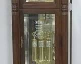 820 - Howard Miller grandfather clock w/ key sun & moon dial face 87 x 25 x 14
