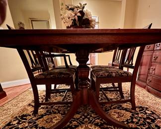 Duncan Phyfe dining table, leg detail. Shaw area rug also for sale.