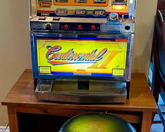 Vintage slot machine, plugged in.