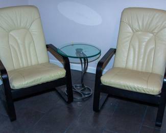 Leather chairs, glass top table