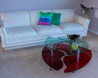 Upholstered couch, glass top coffee table