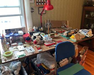 Lots of sewing treasures, fabrics, work table