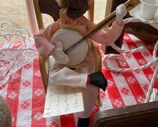 Black doll plying music