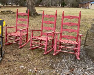 3 Red wooden rocking chairs