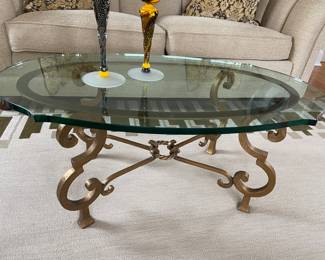 Oval Coffee Table with Solid Glass Top measures approximately 42" x 24"