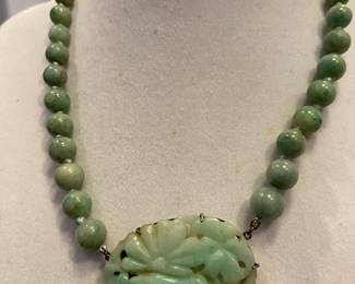 Jadeite Beaded Necklace with Carved Jadeite Floral Medallion in a sterling silver setting