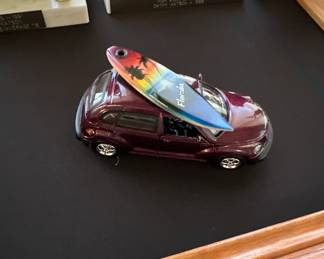 PT cruiser with surfboard