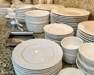 Mikasa ‘English Countryside’  pattern /white
117 + pieces ! Sold by smaller sets & singles :
28 dinner plates, 8 salad plates, 11 soups, 12 cereals, 9 large cereal/serving bowls, 13 dessert plates, 11 sherbets, 8 lg serving bowls, 8 baking dishes, 5 lg platters, 4 lg vegetable bowls, 27 t/c & cappuccino mugs, 2 gravies, butter, 2 salt/pepper sets, 2 sm covered dishes, 11 individual soufflé bowls, pitcher, cake knife & 4 pc Tea/Coffee service w/2 pots & cream/sugar Appears as unused