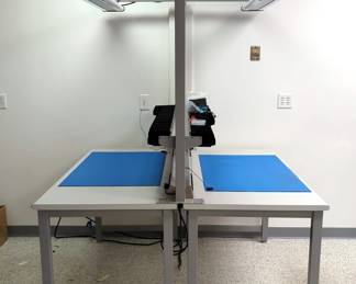 Metal Framed Workstation Tables, Qty 2, With Connecting Overhead Florescent Bulb Two Arm Light, Mounted Electrical Outlets, Grounding Ports, And Hardware Organizers, Assembled Size 82" x 72" x 62"