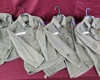 4 US Army Regulation Shirts And 1 Pair Of US Army Regulation Pants.