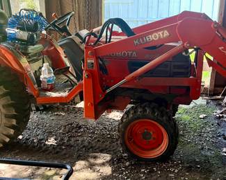 Kubota tractor with lawn mower attachment