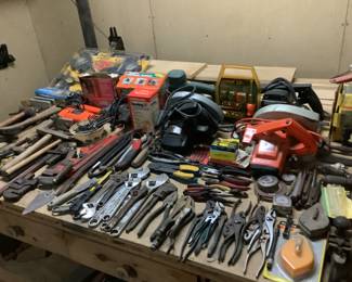 Large workshop with hand tools and wood working equipment 