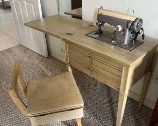 $50 sewing machine and table & chair - as is 