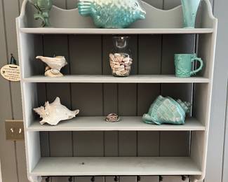 Shelf with beach-themed items