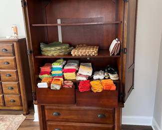 Armoire with kitchen linens