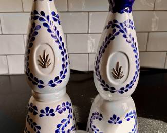Pair of empty hand-painted Clase Azul Reposado tequila bottles.