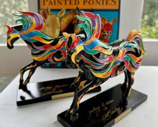Signed Phoenix Painted Ponies with additional paperwork.