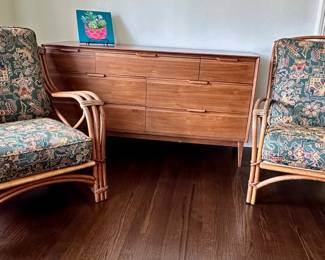 Mid-century modern "American of Martinsville" dresser flanked by his/her pair of mid-century Heywood Wakefield bentwood lounge chairs.