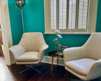 MCM white swivel chairs.