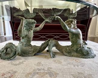 Glass topped coffee table with replica bronze mermaid/mermen base design attributed to Italian artist Putti DiMare.
