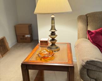 Two wooden family room end tables with glass inlaid tops over wicker detail.  Very heavy well made and in great condition.  $150.00 for the pair.