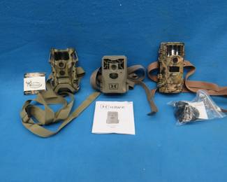 Lot 396. Three untested trail cameras.&nbsp; Manuals and straps included.