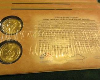 Lot 404. Twenty-two packets of two each gold-colored William Henry Harrison dollar coins (44 coins total)