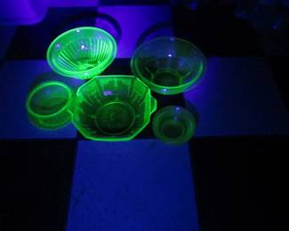 Lot 213. Green Depression-era uranium glass.&nbsp; All pieces glow under a UV light.