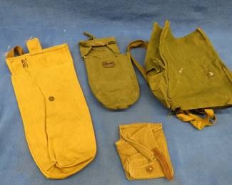 Lot 362. Four vintage military pouches, one is stamped 1958