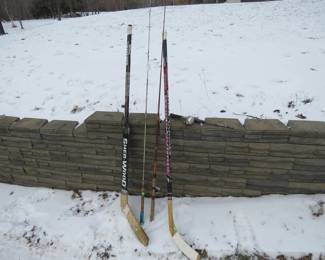 Lot 269. Goalie stick, rh hockey stick, and two fishing rods