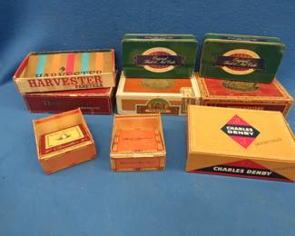 Lot 25. Cigar boxes and two metal fruitcake tins
