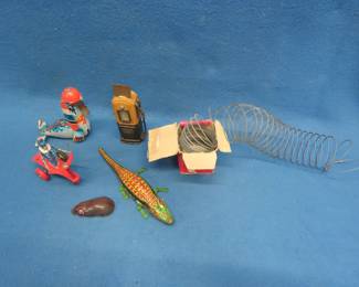 Lot 275. Tin Toys, Slinky, and Scale Gas Pump