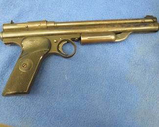 Lot 338. Crosman 130 .22-cal pellet pistol, gun locks, and more