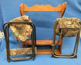 Lot 411. Three-place gun rack and two folding camp stools