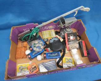 Lot 182. Golf Balls, Cleats, Screw Drivers, Vintage Film, and More