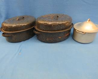 Lot 68. Three roasting pans with lids, cake pans, and bread pans.