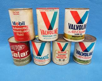 Lot 21. Seven oil or transmission fluid cans.
