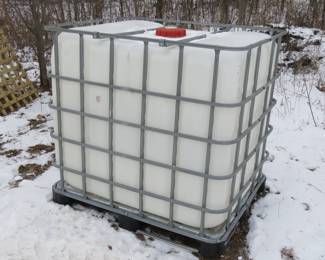 Lot 256. Plastic tank in a pallet frame.&nbsp; 48" x 39" x 40"